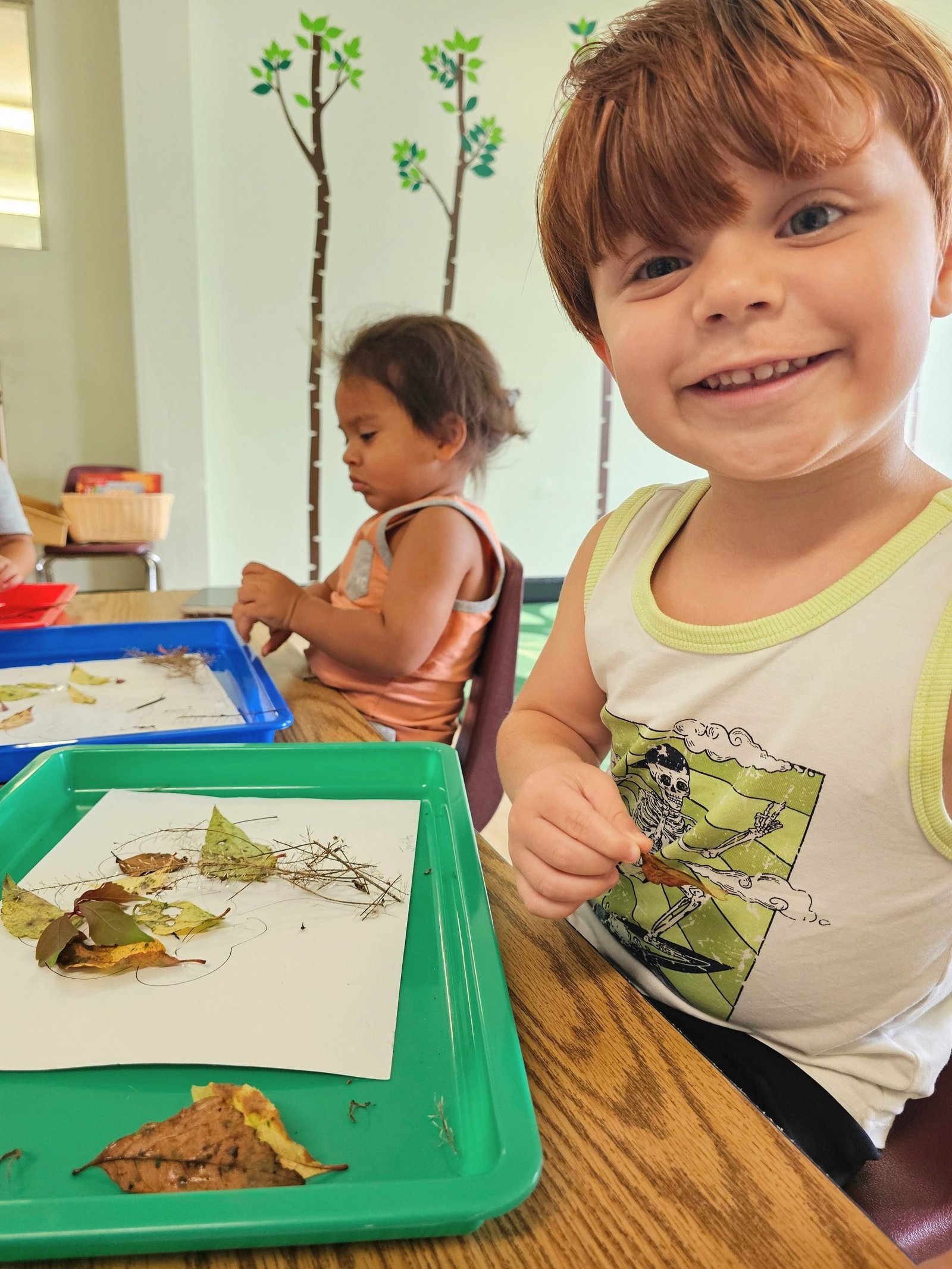 photo of student crafting with nature items